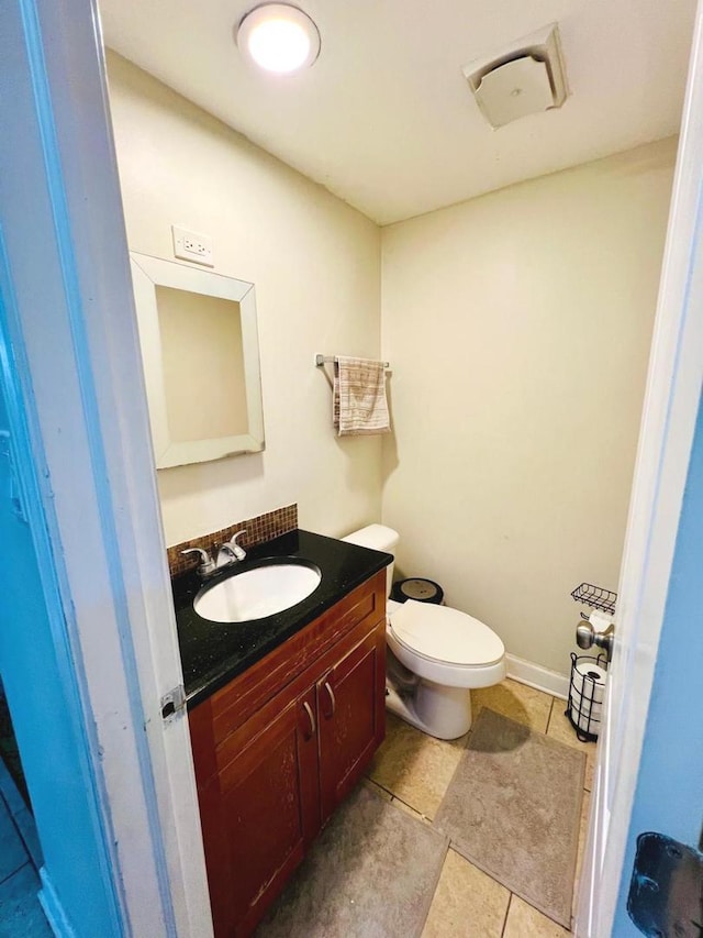 1S215 Stratford Ln, Villa Park, IL 60181 - half bath with vanity, toilet, and tile patterned flooring