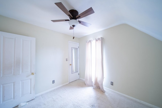 521 Armeida St, Dixon, IL 61021 - unfurnished bedroom featuring carpet flooring, vaulted ceiling, and a ceiling fan