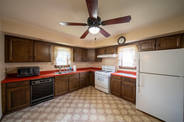 521 Armeida St, Dixon, IL 61021 - kitchen with black appliances, under cabinet range hood, light floors, and a ceiling fan