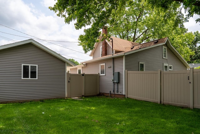 521 Armeida St, Dixon, IL 61021 - rear view of house with a gate and a chimney