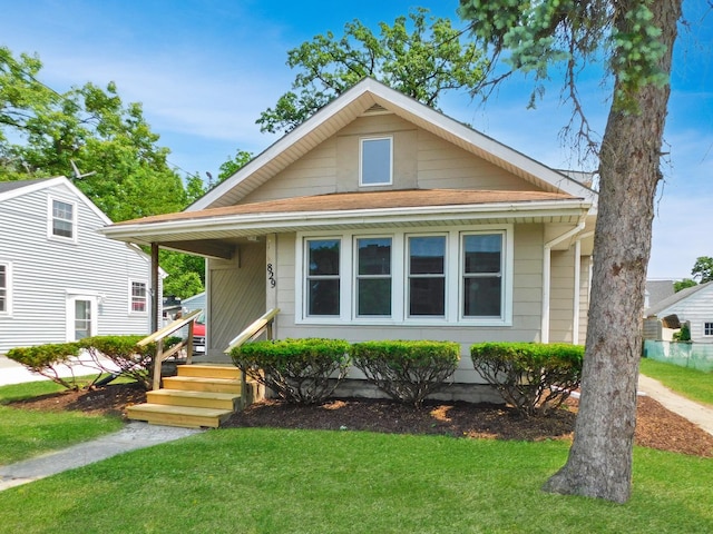 829 Blackhawk Blvd, South Beloit, IL 61080 - view of front of house featuring a front yard and a shingled roof