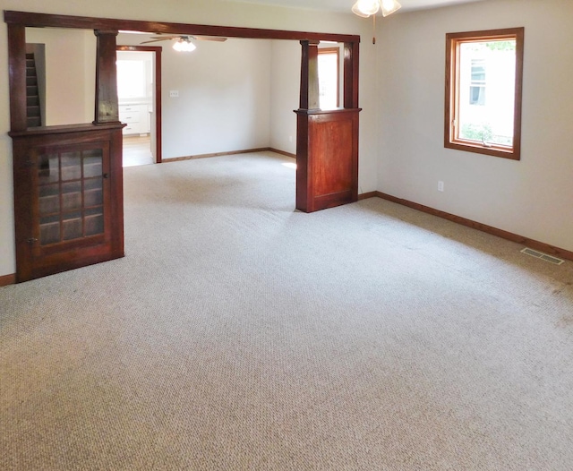 829 Blackhawk Blvd, South Beloit, IL 61080 - unfurnished room with a ceiling fan, plenty of natural light, light colored carpet, and baseboards