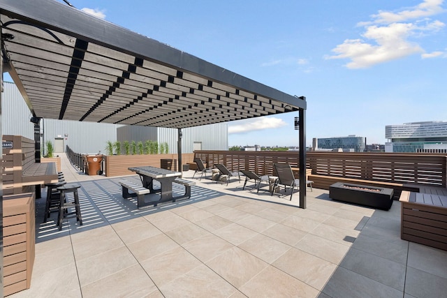 1645 W Ogden Ave Unit 515, Chicago, IL 60612 - view of patio featuring a pergola and a fire pit