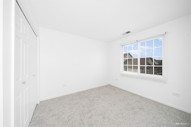10651 Gabrielle Ln, Orland Park, IL 60462 - unfurnished bedroom featuring carpet floors, a closet, and baseboards