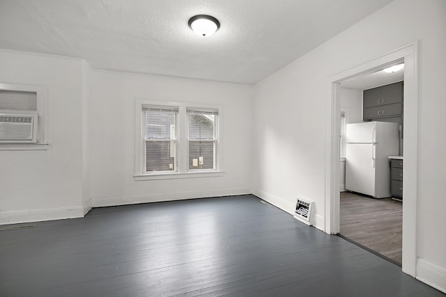 487 S Lincoln Ave, Kankakee, IL 60901 - unfurnished room with wood finished floors, a textured ceiling, and baseboards