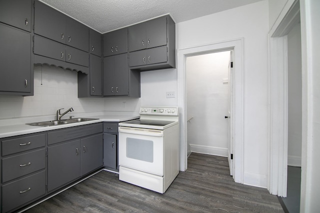 487 S Lincoln Ave, Kankakee, IL 60901 - kitchen with white range with electric cooktop, a sink, gray cabinets, dark wood-type flooring, and light countertops