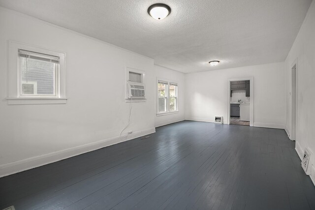 487 S Lincoln Ave, Kankakee, IL 60901 - spare room with a textured ceiling, dark wood-style flooring, and baseboards