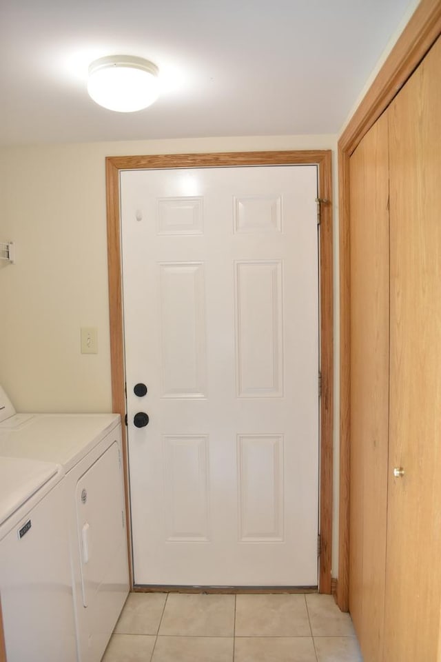 14635 Euclid St Unit D, Cedar Lake, IN 46303 - washroom with washer and clothes dryer and light tile patterned flooring