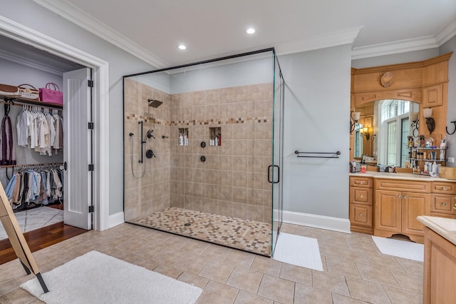 217 Haman Rd, Inverness, IL 60010 - bathroom featuring vanity, a stall shower, ornamental molding, baseboards, and a spacious closet