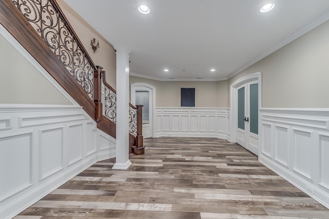 217 Haman Rd, Inverness, IL 60010 - empty room with recessed lighting, wood finished floors, a decorative wall, ornamental molding, and a wainscoted wall