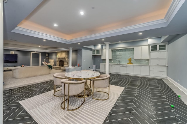 217 Haman Rd, Inverness, IL 60010 - dining space featuring decorative columns, a raised ceiling, recessed lighting, ornamental molding, and baseboards