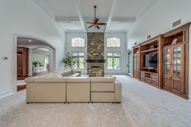 217 Haman Rd, Inverness, IL 60010 - living room featuring carpet flooring, a ceiling fan, beamed ceiling, a stone fireplace, and coffered ceiling