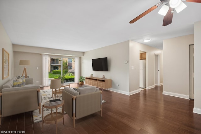 1101 S Hunt Club Dr Unit 101, Mount Prospect, IL 60056 - living area featuring ceiling fan, dark wood finished floors, and baseboards