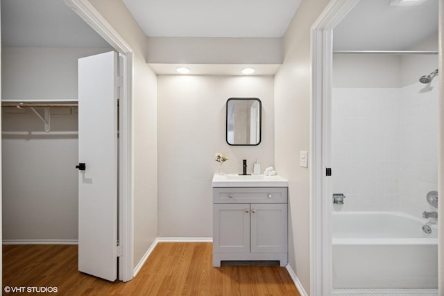1101 S Hunt Club Dr Unit 101, Mount Prospect, IL 60056 - full bath featuring wood finished floors, vanity, shower / washtub combination, and baseboards