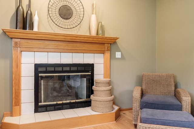 5804 Targee Trl, Roscoe, IL 61073 - detailed view of a fireplace, wood finished floors, and baseboards