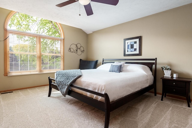 5804 Targee Trl, Roscoe, IL 61073 - bedroom featuring light carpet, baseboards, vaulted ceiling, and a ceiling fan