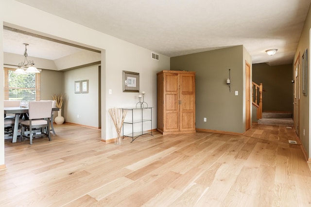 5804 Targee Trl, Roscoe, IL 61073 - dining space with light wood-type flooring, stairway, and baseboards
