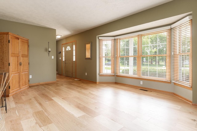 5804 Targee Trl, Roscoe, IL 61073 - entryway featuring baseboards and light wood-style floors
