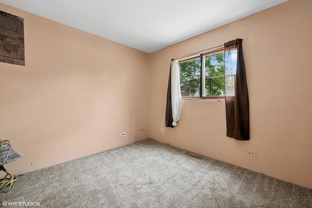 908 Diana Ct, Round Lake Beach, IL 60073 - spare room with carpet