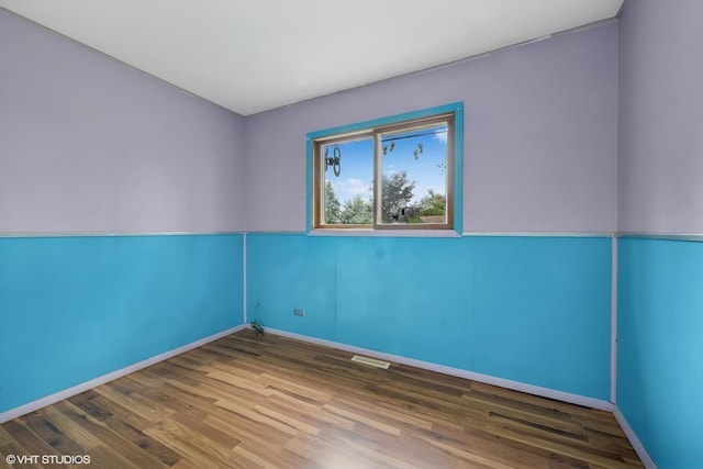 908 Diana Ct, Round Lake Beach, IL 60073 - spare room featuring wood finished floors and baseboards