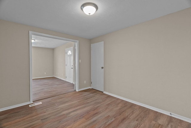 7832 Main St, Walsh, IL 62297 - unfurnished room with wood finished floors and baseboards