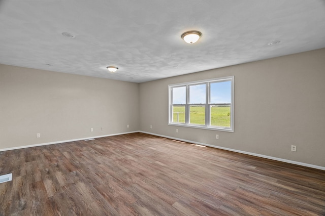 7832 Main St, Walsh, IL 62297 - unfurnished room with baseboards and wood finished floors