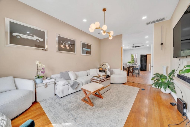 4926 S Winchester Ave, Chicago, IL 60609 - living room featuring light wood-style flooring, a ceiling fan, recessed lighting, and a chandelier