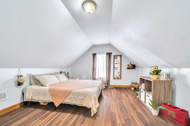 4926 S Winchester Ave, Chicago, IL 60609 - bedroom featuring wood finished floors, baseboards, and vaulted ceiling