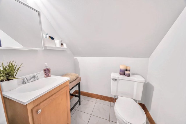 4926 S Winchester Ave, Chicago, IL 60609 - half bathroom featuring toilet, vaulted ceiling, vanity, and baseboards