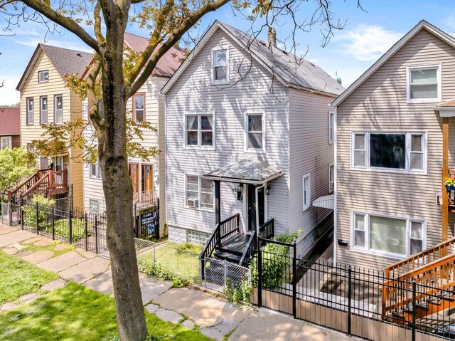 4926 S Winchester Ave, Chicago, IL 60609 - view of front facade featuring stairway and a chimney