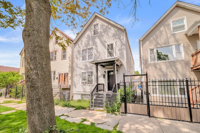4926 S Winchester Ave, Chicago, IL 60609 - view of front facade with a gate and a fenced front yard