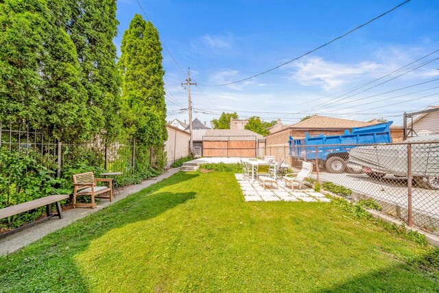 4926 S Winchester Ave, Chicago, IL 60609 - view of yard featuring a patio