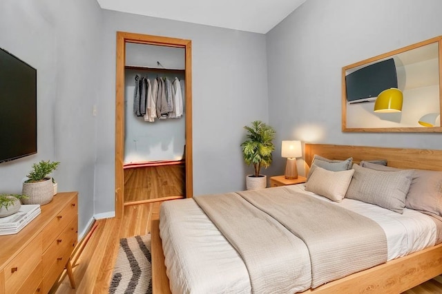 4926 S Winchester Ave, Chicago, IL 60609 - bedroom with light wood-type flooring and baseboards