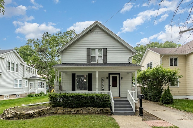 614 Oak Ave, Aurora, IL 60506 - view of front of home featuring a porch and a front yard