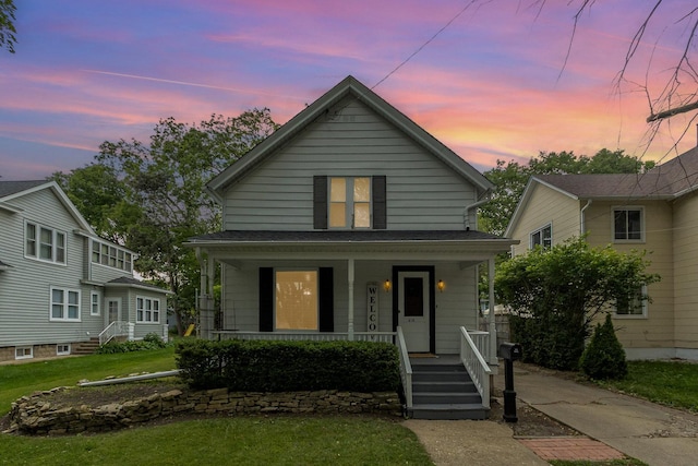 614 Oak Ave, Aurora, IL 60506 - view of front of home featuring a porch and a front yard