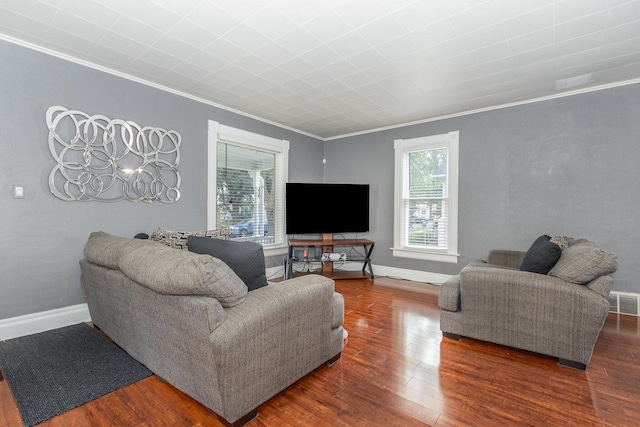 614 Oak Ave, Aurora, IL 60506 - living room featuring ornamental molding, wood finished floors, and baseboards