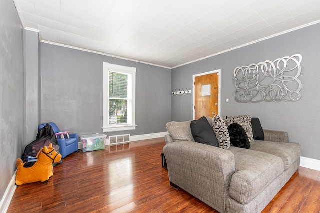 614 Oak Ave, Aurora, IL 60506 - living area featuring crown molding, wood finished floors, and baseboards