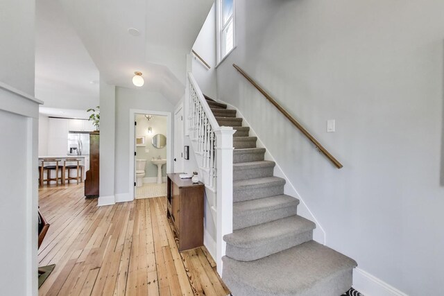 3719 W Shakespeare Ave, Chicago, IL 60647 - stairway featuring hardwood / wood-style flooring and baseboards