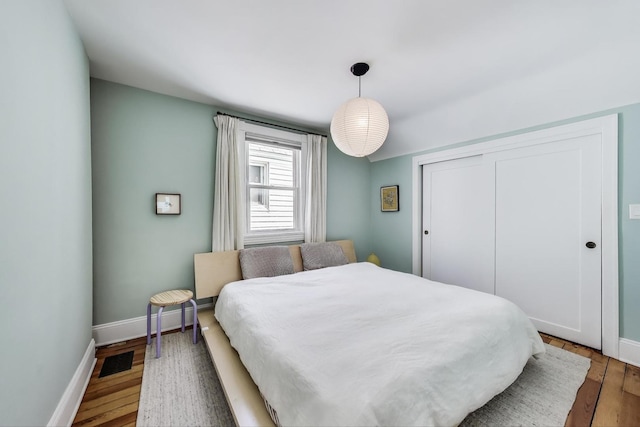 3719 W Shakespeare Ave, Chicago, IL 60647 - bedroom featuring wood finished floors and a closet