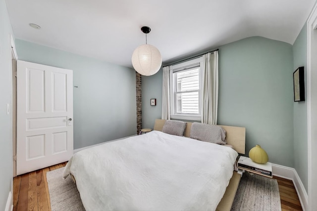 3719 W Shakespeare Ave, Chicago, IL 60647 - bedroom featuring wood finished floors and vaulted ceiling