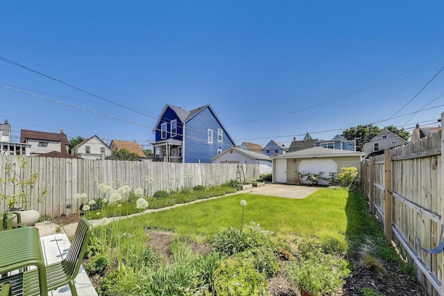 3719 W Shakespeare Ave, Chicago, IL 60647 - fenced backyard with a patio area and a detached garage