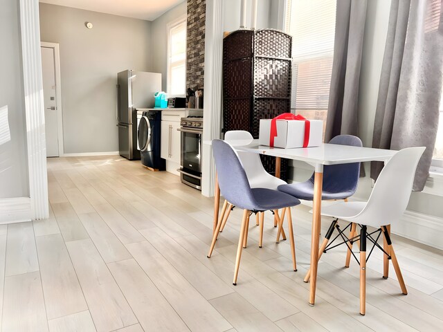 2307 S Leavitt St, Chicago, IL 60608 - dining area with light wood finished floors and baseboards