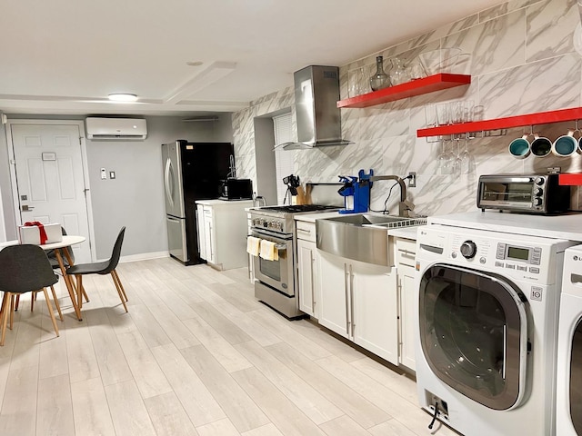 2307 S Leavitt St, Chicago, IL 60608 - kitchen featuring stainless steel appliances, wall chimney range hood, a wall mounted air conditioner, a sink, and open shelves