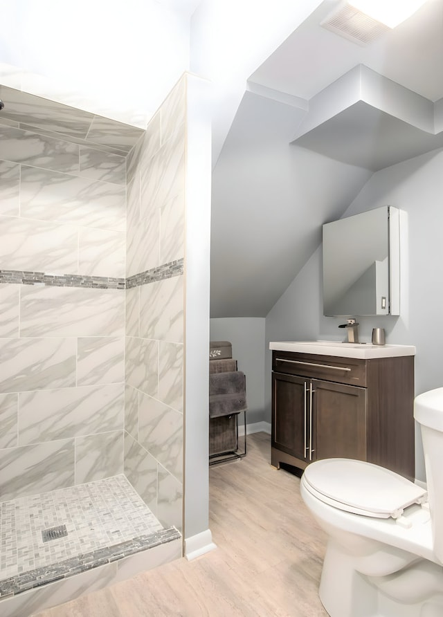2307 S Leavitt St, Chicago, IL 60608 - full bath with toilet, a shower stall, vanity, and wood finished floors