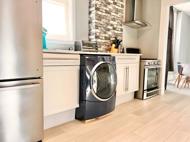 2307 S Leavitt St, Chicago, IL 60608 - washroom with washer / dryer and light wood-style floors