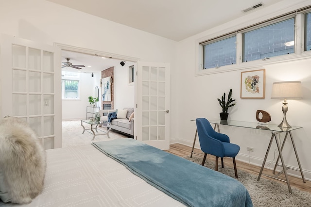 2433 W Haddon Ave Unit 1E, Chicago, IL 60622 - bedroom with french doors, wood finished floors, and baseboards
