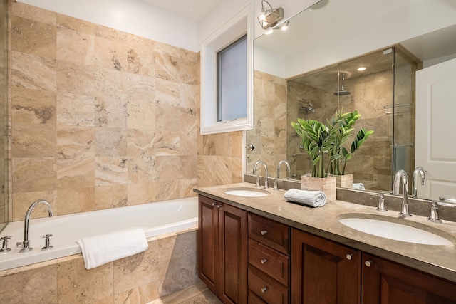 2433 W Haddon Ave Unit 1E, Chicago, IL 60622 - bathroom featuring double vanity, a garden tub, a tile shower, and tile walls