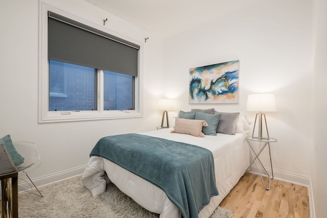2433 W Haddon Ave Unit 1E, Chicago, IL 60622 - bedroom with baseboards and wood finished floors