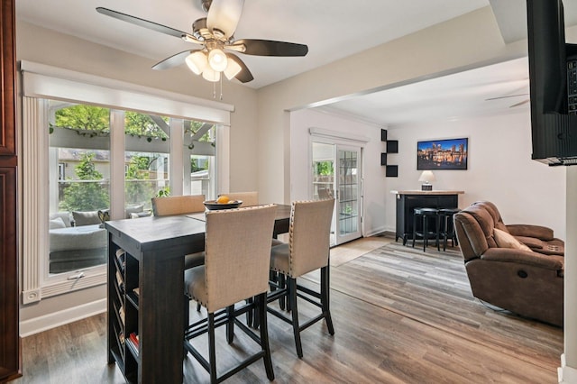 2313 Modaff Rd, Naperville, IL 60565 - dining space featuring a ceiling fan, wood finished floors, and baseboards