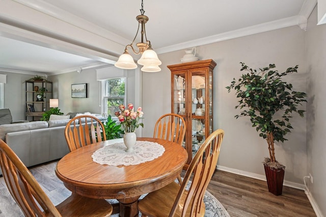 2313 Modaff Rd, Naperville, IL 60565 - dining area with wood finished floors, crown molding, and baseboards
